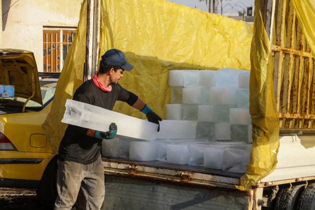 Heat wave affects Iraq causing an increase in demand for ice BAGHDAD, IRAQ - AUGUST 13 : People queue and buy ice blocks at production centers and retail points as a heatwave sweeping across Iraq, prompts residents to rely on ice to cool down and maintain daily life amid above-normal seasonal temperatures on August 13, 2026 in Baghdad, Iraq. Murtadha Al-Sudani Anadolu Baghdad Iraq. Editorial use only. Please get in touch for any other usage.  Copyright: x2026xAnadoluxMurtadhaxAl-Sudanix