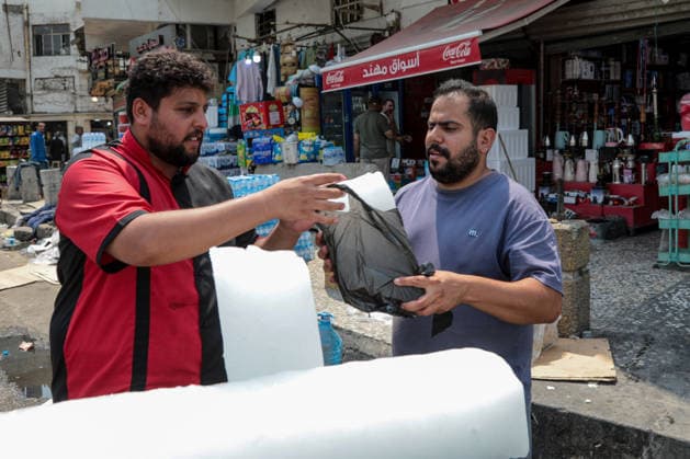 Heat wave affects Iraq causing an increase in demand for ice BAGHDAD, IRAQ - AUGUST 13 : People queue and buy ice blocks at production centers and retail points as a heatwave sweeping across Iraq, prompts residents to rely on ice to cool down and maintain daily life amid above-normal seasonal temperatures on August 13, 2026 in Baghdad, Iraq. Murtadha Al-Sudani Anadolu Baghdad Iraq. Editorial use only. Please get in touch for any other usage.  Copyright: x2026xAnadoluxMurtadhaxAl-Sudanix