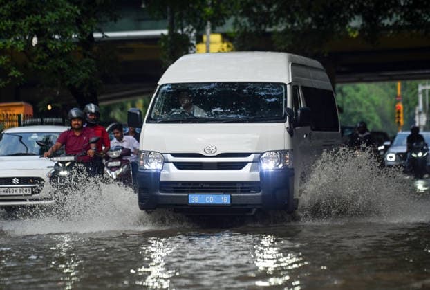 Heavy rain lashes parts of the National Capital New Delhi, Aug 13 (ANI): Commuters wade through a waterlogged road near SIR M. Vishweshwariah Moti Bagh metro station following heavy rainfall, in New Delhi on Thursday. New Delhi Delhi India Copyright: xANIx ANI_20260813267