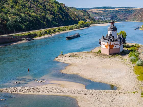 The water level of the Rhine is at a record low. Shipping on the Rhine is severely disrupted by the low water levels. Only a few ships are still sailing, and those are operating with reduced cargo. Pfalzgrafenstein Castle in Kaub on the Middle Rhine. This landmark is a former customs fortress built on a rocky island in the Rhine. August 12, 2026, Kaub,
