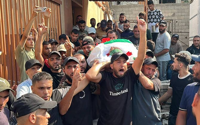 Mourners carry the body of Huthaifa Kawara during his funeral at Nasser Hospital in Khan Younis, Gaza, Palestine, on August 13, 2026. Kawara, a field commander of the Izz al-Din al-Qassam Brigades, Hamas s military wing, was killed in an Israeli airstrike in Khan Younis. Israel also assassinated the Gaza City police chief.  GAZ2026081319 SaidxAbid