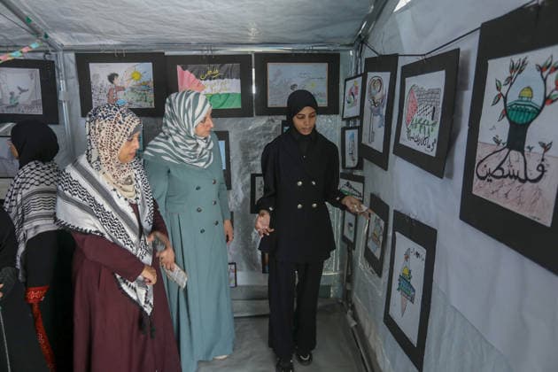 Palestinian children reflect war, displacement and hope through Art in Khan Yunis KHAN YUNIS, GAZA , PALESTINE - AUGUST 13: Works by Palestinian children are brought together in the exhibition held inside a tent at a refugee camp in the Al-Mawasi area of Khan Yunis, Gaza, Palestine on August 13, 2026. Created amid the severe humanitarian conditions resulting from the attacks that have continued since Oct. 2023, the artworks depict the children s experiences of displacement, destruction, hunger, water shortages and the loss of loved ones. Abed Rahim Khatib Anadolu Han Yunus Palestinian Territory, Occupied. Editorial use only. Please get in touch for any other usage.  Copyright: x2026xAnadoluxAbedxRahimxKhatibx