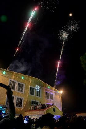 Pakistan Independence Day Celebrations Rawalpindi Fireworks rise above an illuminated building as spectators raise their phones during Independence Day celebrations in Rawalpindi, Pakistan, on August 14, 2026. Pakistan marks Independence Day on August 14, commemorating the countryis independence from British rule in 1947. Rawalpindi Punjab Pakistan Copyright: xZubairxAbbasix