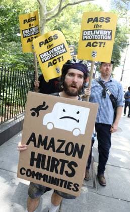 August 13, 2026, New York, New York, USA: Amazon Teamsters and Allies picket outside of City Hall for passage of the Delivery Protection Act. The Delivery Protection Act would require companies like Amazon to hire its workforce directly, essentially making Amazon s corrupt third-party Delivery Service Partner model illegal in New York City. New York USA - ZUMAk03_ 20260813_zaf_k03_064 Copyright: xNancyxKaszermanx