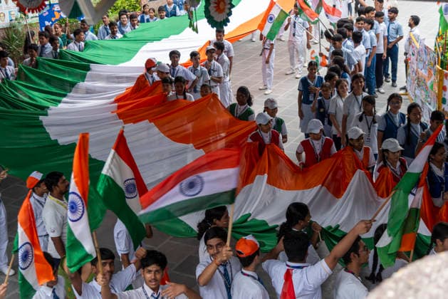 August 14, 2026, New Delhi, Delhi, India: Students and teachers take part in a Tiranga Yatra as a Delhi school celebrates IndiaÃ¢â‚¬â ¢s 80th Independence Day in New Delhi. Students carry a 100 foot long Indian national flag during the procession, promoting a message of unity, solidarity and national pride. New Delhi India  - ZUMAt180 20260814_zip_t180_002 Copyright: xJaixThakurx