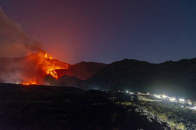 Mount Etna s eruptive activity continues CATANIA, ITALY - AUGUST 14: Mount Etna s eruptive activity continues, with active lava flows fed by vents located at 2,750 and 1,900 meters of altitude, alongside ongoing ash emissions from the Voragine summit crater in Catania, Sicily, Italy on August 14, 2026. The spectacular glowing lava streams have attracted an exceptional influx of hikers, tourists, and curious onlookers eager to witness the volcanic phenomenon at night. In response to this dangerous mass exodus towards the active lava fronts, local authorities have implemented strict roadblocks, parking bans along key mountain routes like the Mareneve road, and restricted access to the affected areas to ensure public safety. Meanwhile, the con  Copyright: x2026xAnadoluxSalvatorexAllegrax