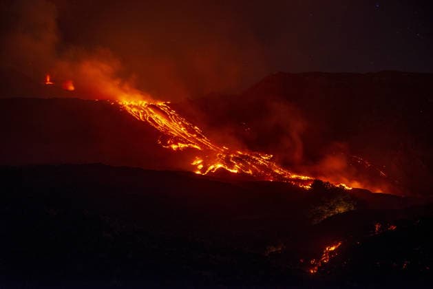 Mount Etna s eruptive activity continues CATANIA, ITALY - AUGUST 14: Mount Etna s eruptive activity continues, with active lava flows fed by vents located at 2,750 and 1,900 meters of altitude, alongside ongoing ash emissions from the Voragine summit crater in Catania, Sicily, Italy on August 14, 2026. The spectacular glowing lava streams have attracted an exceptional influx of hikers, tourists, and curious onlookers eager to witness the volcanic phenomenon at night. In response to this dangerous mass exodus towards the active lava fronts, local authorities have implemented strict roadblocks, parking bans along key mountain routes like the Mareneve road, and restricted access to the affected areas to ensure public safety. Meanwhile, the con  Copyright: x2026xAnadoluxSalvatorexAllegrax
