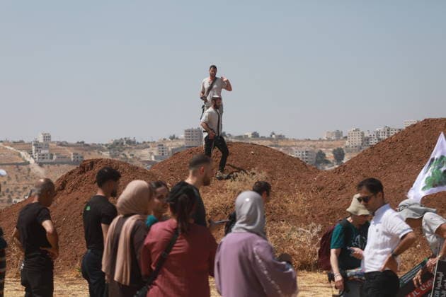 Israeli violations against Palestinians continue HEBRON, WEST BANK, PALESTINE - AUGUST 14: Palestinians and foreign activists gather to protest in support of their land, which they say is under threat of being seized by Israelis, and to express their determination not to leave their properties in Beit Sahour, Hebron Governorate, West Bank, on August 14, 2026. Armed Israelis who came to the area intervened and attempted to disperse the group. Mamoun Wazwaz Anadolu Hebron West Bank. Editorial use only. Please get in touch for any other usage.  Copyright: x2026xAnadoluxMamounxWazwazx
