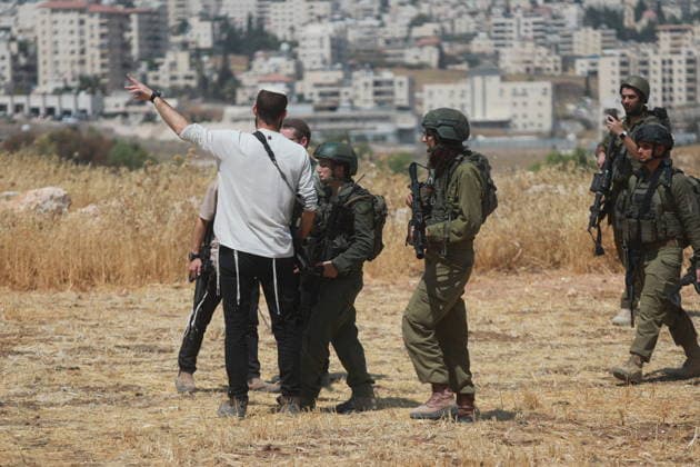 Israeli violations against Palestinians continue HEBRON, WEST BANK, PALESTINE - AUGUST 14: Palestinians and foreign activists gather to protest in support of their land, which they say is under threat of being seized by Israelis, and to express their determination not to leave their properties in Beit Sahour, Hebron Governorate, West Bank, on August 14, 2026. Armed Israelis who came to the area intervened and attempted to disperse the group. Mamoun Wazwaz Anadolu Hebron West Bank. Editorial use only. Please get in touch for any other usage.  Copyright: x2026xAnadoluxMamounxWazwazx