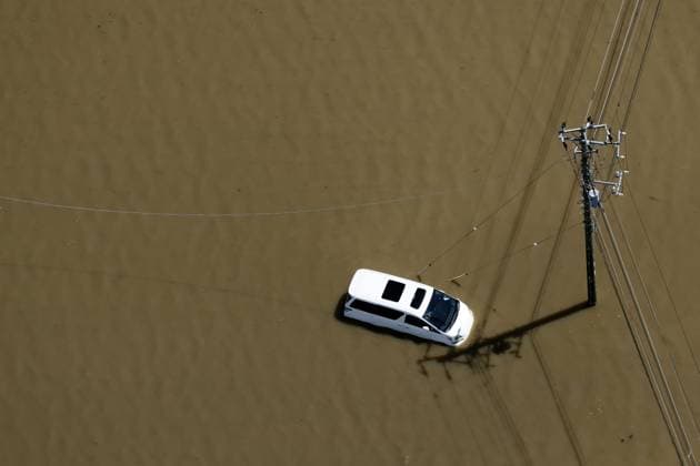 Aftermath of torrential rain in eastern Japan Photo taken from a Kyodo News helicopter shows a vehicle submerged in floodwater in Oamishirasato in Chiba Prefecture, east of Tokyo, on Aug. 14, 2026, after torrential rain overnight.  A14AA0005625808P