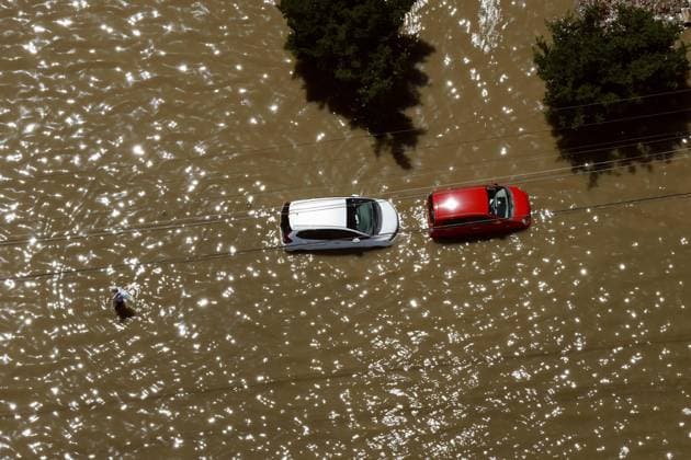 Aftermath of torrential rain in eastern Japan Photo taken from a Kyodo News helicopter shows vehicles submerged in floodwater in Oamishirasato in Chiba Prefecture, east of Tokyo, on Aug. 14, 2026, after torrential rain overnight.  A14AA0005625809P