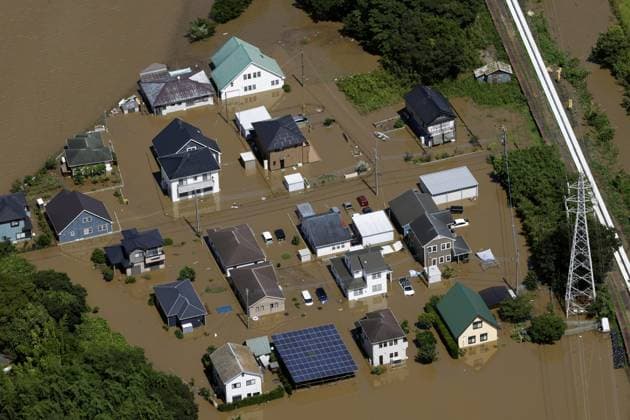 Aftermath of torrential rain in eastern Japan Photo taken from a Kyodo News helicopter shows a residential area submerged in floodwater in Oamishirasato in Chiba Prefecture, east of Tokyo, on Aug. 14, 2026, after torrential rain overnight.  A14AA0005625812P