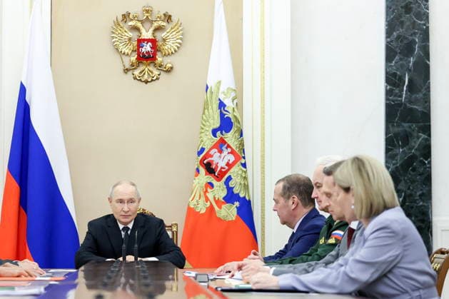 RUSSIA, MOSCOW - AUGUST 14, 2026: Russia s President Vladimir Putin (L) is seen during a meeting of standing members of Russia s Security Council in the Kremlin. Alexander Kazakov Russian Presidential Press and Information Office TASS  96139811