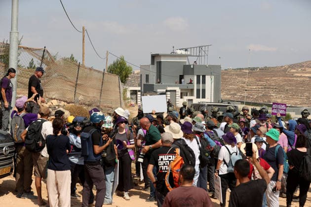 Activists attempt to deliver supplies to Palestinian families near Nablus NABLUS, WEST BANK, PALESTINE - AUGUST 14: Palestinian, Israeli and foreign activists attempt to deliver basic supplies to three Palestinian families living in the Ras al-Ayn area of Qusra, south of Nablus in the West Bank, Palestine, on August 14, 2026, as Israelis have blocked roads leading to the families’ homes since August 9, restricting access to and from the area in the presence of Israeli soldiers, with the restrictions remaining in place. Issam Rimawi Anadolu Nablus West Bank. Editorial use only. Please get in touch for any other usage.  Copyright: x2026xAnadoluxIssamxRimawix