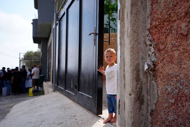 Activists attempt to deliver supplies to Palestinian families near Nablus NABLUS, WEST BANK, PALESTINE - AUGUST 14: A Palestinian child stands at the entrance of a home in the Ras al-Ayn area of Qusra, south of Nablus in the West Bank, Palestine, on August 14, 2026, as access to three Palestinian families in the area remains restricted after roads leading to their homes were blocked on August 9. Issam Rimawi Anadolu Nablus West Bank. Editorial use only. Please get in touch for any other usage.  Copyright: x2026xAnadoluxIssamxRimawix