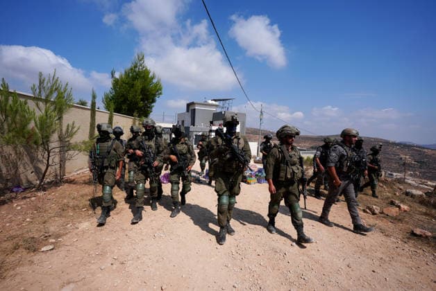 Activists attempt to deliver supplies to Palestinian families near Nablus NABLUS, WEST BANK, PALESTINE - AUGUST 14: Palestinian, Israeli and foreign activists attempt to deliver basic supplies to three Palestinian families living in the Ras al-Ayn area of Qusra, south of Nablus in the West Bank, Palestine, on August 14, 2026, as Israelis have blocked roads leading to the families’ homes since August 9, restricting access to and from the area in the presence of Israeli soldiers, with the restrictions remaining in place. Issam Rimawi Anadolu Nablus West Bank. Editorial use only. Please get in touch for any other usage.  Copyright: x2026xAnadoluxIssamxRimawix