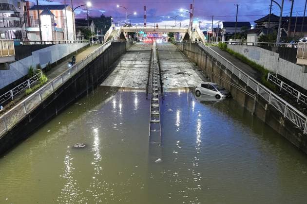 Aftermath of torrential rain in Chiba A vehicle is seen stranded at a flooded underpass in Chiba, near Tokyo, on Aug. 14, 2026, following torrential rain overnight.  A14AA0005625822P