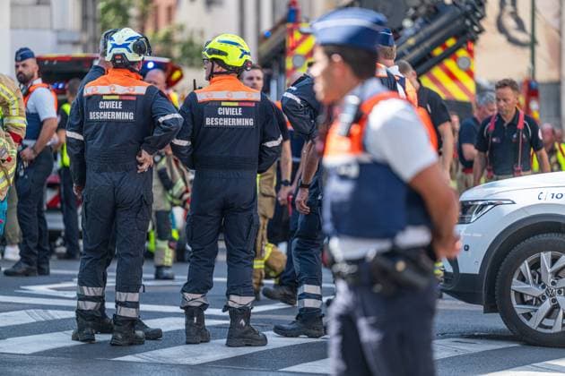 Emergency services pictured on the site of an explosion at the Treurenberg in the city center of Brussels, Friday 14 August 2026. According to the first information, two explosion happened in a building which was evacuated earlier in the day after a gas leak was detected, injuring two people.  EMILExWINDAL 1081058048st