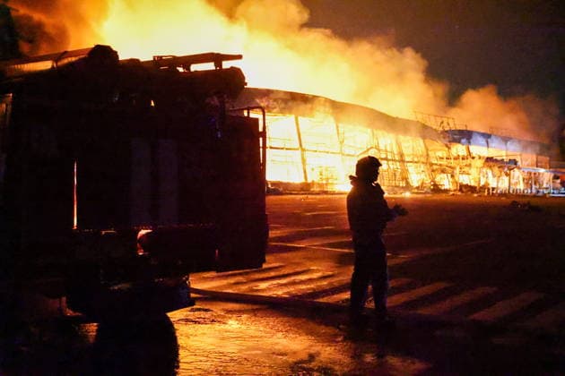 RUSSIA, DONETSK PEOPLE S REPUBLIC - AUGUST 14, 2026: An emergency worker battles a fire caused by a Ukrainian drone strike on the Galaktika Galaxy shopping centre in Yenakiyevo, northeast of Donetsk. Dmitry Yagodkin TASS  96146265