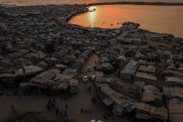 Daily life in Gaza amid the ongoing Israeli attacks despite ceasefire GAZA CITY, GAZA, PALESTINE - AUGUST 14: Displaced Palestinians living along the coastal strip of blockaded Gaza City carry out daily activities among the ruins of destroyed buildings during sunset in Gaza, Palestine on August 14, 2026. Deprived of basic necessities following Israeli attacks, families struggle to survive in makeshift tents pitched near the rubble of their homes and inside heavily damaged structures under severe conditions. Ali Jadallah Anadolu Gaza City Gaza. Editorial use only. Please get in touch for any other usage.  Copyright: x2026xAnadoluxAlixJadallahx
