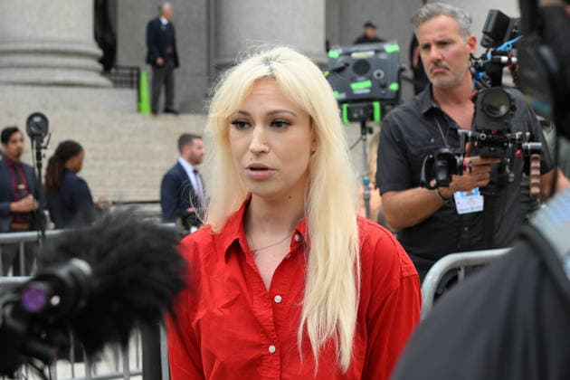 August 14, 2026, New York, New York, USA: August 14, 2026 - New York, NY, USA - Mangione supporter seen after Luigi Mangione enters an open guilty plea in federal court, admitting to all charges without any accommodations. He faces a maximum penalty of life in prison for the assassination of United Healthcare CEO, Brian Thompson on a Manhattan street. (Andrea RENAULT Zuma Press) New York USA  - ZUMAg115 20260814_faf_g115_002 Copyright: xAndreaxRenaultx