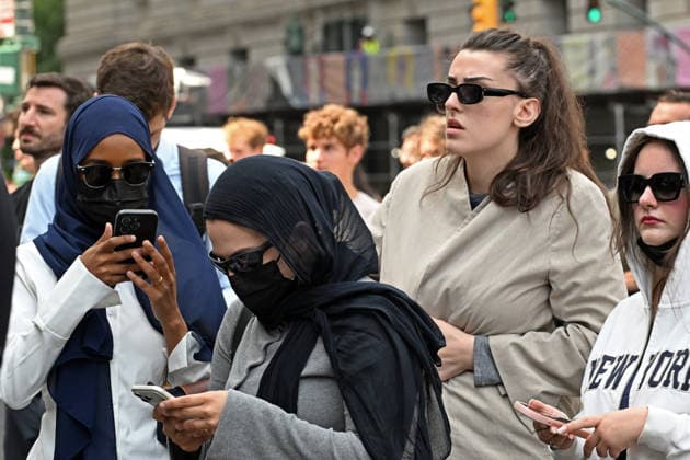 August 14, 2026, New York, New York, USA: August 14, 2026 - New York, NY, USA - Mangione supporters seen after Luigi Mangione enters an open guilty plea in federal court, admitting to all charges without any accommodations. He faces a maximum penalty of life in prison for the assassination of United Healthcare CEO, Brian Thompson on a Manhattan street. (Andrea RENAULT Zuma Press) New York USA  - ZUMAg115 20260814_faf_g115_009 Copyright: xAndreaxRenaultx