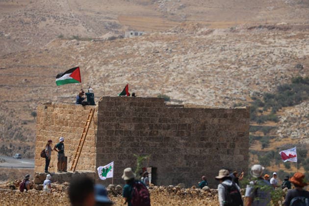 Activists Remove Flags From Beit Sahour Palestinian flags fly from the roof of a Palestinian home as activists gather nearby in Beit Sahour, east of Bethlehem in the occupied West Bank, on August 14, 2026. The activists said settlers had placed the symbols on the house after October 7, 2023, in what they described as an attempt to seize control of the property, and that settlers opened fire toward them as the items were removed, with no injuries reported. Bethlehem West Bank Palestinian Territories Copyright: xMosabxShawerx