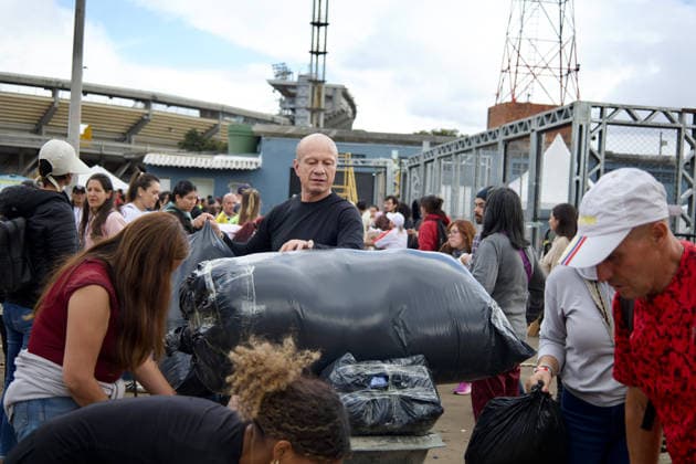 August 14, 2026, Bogota, Bogota D.C, Colombia: People in Bogota, Colombia gather to collect and categorize donations for the victims of the 7,4 earthquake that struck Colombia on August 10 outside El Campin Stadium on August 14, 2026. Bogota Colombia - ZUMAvp1_ 20260814_zia_vp1_023 Copyright: xIsabellaxBobadillax