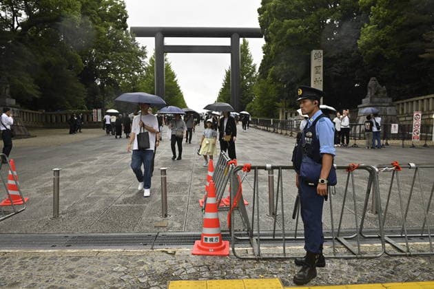 Japan commemorates war dead on 81st anniversary of end of World War II TOKYO, JAPAN - AUGUST 15 : A police officer stands guard near the main entrance of Yasukuni Shrine in Tokyo, Japan, August 15, 2026. David Mareuil Anadolu Tokyo Japan. Editorial use only. Please get in touch for any other usage.  Copyright: x2026xAnadoluxDavidxMareuilx