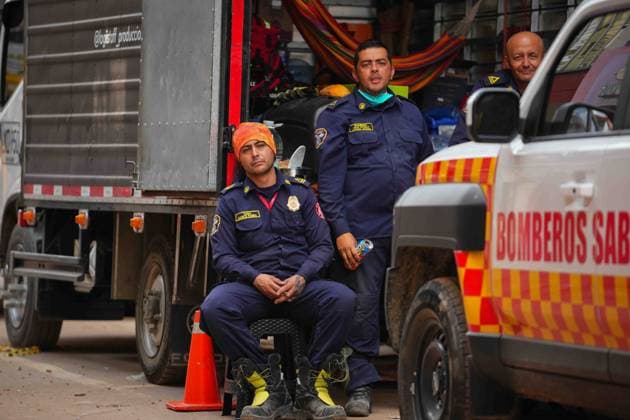 (260815) -- PEREIRA, Aug. 15, 2026 -- Firefighters rest during a break in Pereira, Colombia on Aug. 14, 2026 . A 7.4-magnitude earthquake jolted western Colombia on Monday. (Photo by Xinhua) COLOMBIA-PEREIRA-EARTHQUAKE-AFTERMATH AndresxMoreno 