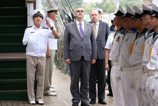 NORTH KOREA, WONSAN - AUGUST 15, 2026: The Pallada s Captain Nikolai Zorchenko (L) and Russia s Ambassador to DPRK Vladimir Topekha (C) shake hands during a ceremony marking the arrival of the Russian training tallship Pallada. The ship arrived in the Democratic People s Republic of Korea on a friendly visit for festivities marking the 81st anniversary of the liberation of Korea from Japanese occupation, on 15 August. Stanislav Varivoda TASS  96176922