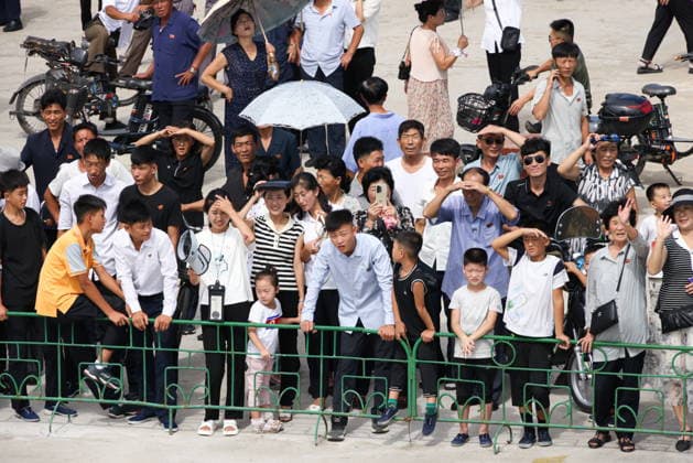 NORTH KOREA, WONSAN - AUGUST 15, 2026: Members of the public are seen during a ceremony marking the arrival of the Russian training tallship Pallada. The ship arrived in the Democratic People s Republic of Korea on a friendly visit for festivities marking the 81st anniversary of the liberation of Korea from Japanese occupation, on 15 August. Stanislav Varivoda TASS  96177020