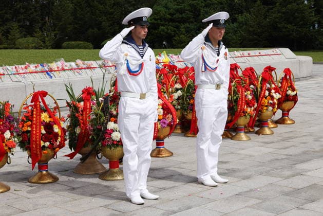 NORTH KOREA, WONSAN - AUGUST 15, 2026: Crew members take part in a wreath laying ceremony at the Wonsan Bronze Statues of Kim Il Sung and Kim Jong Il after the arrival of the Russian training tallship Pallada. The ship arrived in the Democratic People s Republic of Korea on a friendly visit for festivities marking the 81st anniversary of the liberation of Korea from Japanese occupation, on 15 August. Stanislav Varivoda TASS  96177055