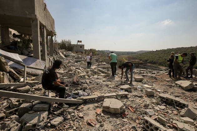 August 15, 2026, Ansar, Ansar, Lebanon: People inspect destruction caused by an Israeli air strike in the southern Lebanese village of Ansar. Seven people were killed and three other wounded in the attack, one of the deadliest attacks since a precarious truce between Israel and pro-Iranian Hezbollah went into effect on June 20. Ansar Lebanon  - ZUMAn313 20260815_zip_n313_003 Copyright: xMarwanxNaamanix