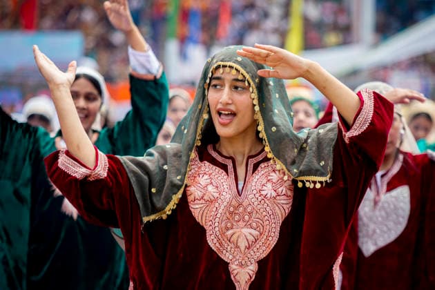 August 15, 2026, Srinagar, Jammu And Kashmir, India: Girls dress in traditional Kashmiri attire dance before ministers and bureaucrats during a ceremony marking India™s 80th Independence Day at Bakshi Stadium in Srinagar, the summer capital of Jammu and Kashmir. The ceremony included the unfurling of the national flag, a ceremonial parade and cultural performances. Srinagar India - ZUMAs197 20260815_aaa_s197_067 Copyright: xFaisalxBashirx