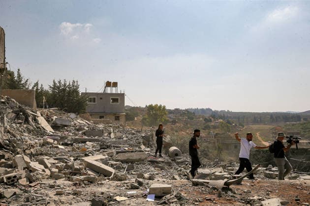 August 15, 2026, Ansar, Ansar, Lebanon: Members of the press take footages of wreckage caused by an Israeli air strike is seen in the southern Lebanese village of Ansar. Seven people were killed and three other wounded in the attack, one of the deadliest attacks since a precarious truce between Israel and pro-Iranian Hezbollah went into effect on June 20. Ansar Lebanon - ZUMAn313 20260815_zip_n313_008 Copyright: xMarwanxNaamanix