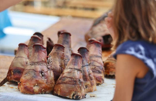 Blessed Virgin Mary celebration in Croatia Vendors sell spit roast pork during a Feast of Assumption of the Blessed Virgin Mary celebration in Sinj, Croatia on August 15, 2026.  IvoxCagalj PIXSELL