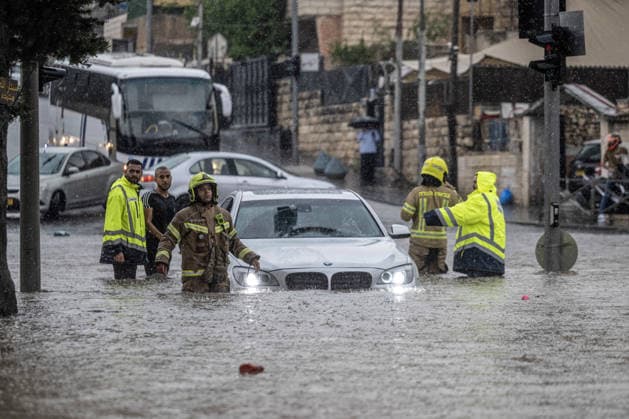 Flash floods submerge vehicles in East Jerusalem neighborhood following heavy rainfall EAST JERUSALEM - AUGUST 15: People wade through flooded roads and submerged vehicles are seen in the Wadi al-Joz neighborhood of East Jerusalem on August 15, 2026, after unseasonal heavy rainfall triggered localized flash flooding across the area. Search and rescue teams were dispatched to the district as rising waters trapped cars, disrupted traffic flow, and damaged infrastructure across low-lying urban streets. Mostafa Alkharouf Anadolu Jerusalem Israel. Editorial use only. Please get in touch for any other usage.  Copyright: x2026xAnadoluxMostafaxAlkharoufx