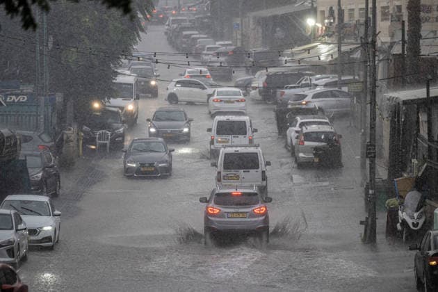 Flash floods submerge vehicles in East Jerusalem neighborhood following heavy rainfall EAST JERUSALEM - AUGUST 15: Submerged vehicles are seen in the Wadi al-Joz neighborhood of East Jerusalem on August 15, 2026, after unseasonal heavy rainfall triggered localized flash flooding across the area. Search and rescue teams were dispatched to the district as rising waters trapped cars, disrupted traffic flow, and damaged infrastructure across low-lying urban streets. Mostafa Alkharouf Anadolu Jerusalem Israel. Editorial use only. Please get in touch for any other usage.  Copyright: x2026xAnadoluxMostafaxAlkharoufx