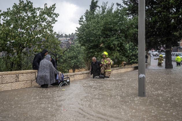 Flash floods submerge vehicles in East Jerusalem neighborhood following heavy rainfall EAST JERUSALEM - AUGUST 15: People wade through flooded roads and submerged vehicles are seen in the Wadi al-Joz neighborhood of East Jerusalem on August 15, 2026, after unseasonal heavy rainfall triggered localized flash flooding across the area. Search and rescue teams were dispatched to the district as rising waters trapped cars, disrupted traffic flow, and damaged infrastructure across low-lying urban streets. Mostafa Alkharouf Anadolu Jerusalem Israel. Editorial use only. Please get in touch for any other usage.  Copyright: x2026xAnadoluxMostafaxAlkharoufx