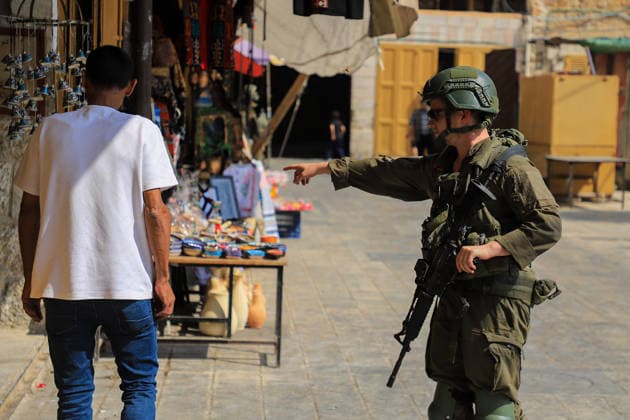 Israeli settlers raid historic Old City of Hebron in West Bank under military escort HEBRON, WEST BANK, PALESTINE - AUGUST 15: Israeli military personnel restrict the movement of local Palestinians during a raid by Israeli settlers in the Old City of Hebron, located in the southern West Bank, Palestine on August 15, 2026. Escorted by armed Israeli forces, the settlers entered the historic district while soldiers blocked key entry and exit points, severely limiting the daily mobility and access of Palestinian residents living in the area. Amer Shallodi Anadolu Hebron West Bank. Editorial use only. Please get in touch for any other usage.  Copyright: x2026xAnadoluxAmerxShallodix