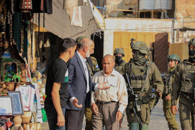 Israeli settlers raid historic Old City of Hebron in West Bank under military escort HEBRON, WEST BANK, PALESTINE - AUGUST 15: Israeli military personnel restrict the movement of local Palestinians during a raid by Israeli settlers in the Old City of Hebron, located in the southern West Bank, Palestine on August 15, 2026. Escorted by armed Israeli forces, the settlers entered the historic district while soldiers blocked key entry and exit points, severely limiting the daily mobility and access of Palestinian residents living in the area. Amer Shallodi Anadolu Hebron West Bank. Editorial use only. Please get in touch for any other usage.  Copyright: x2026xAnadoluxAmerxShallodix