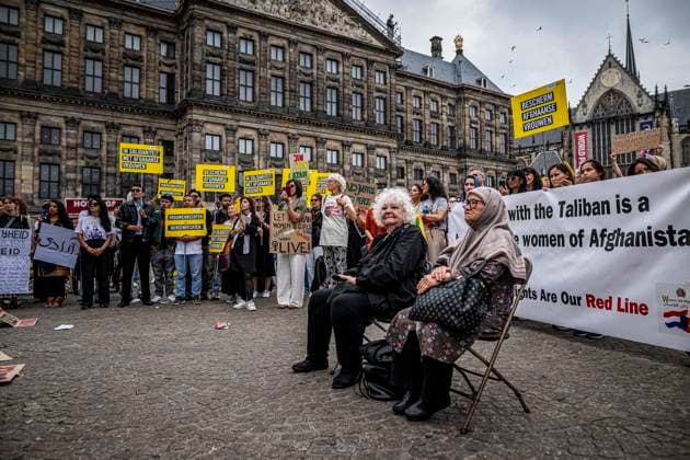 August 15, 2026, Amsterdam, North Holland, The Netherlands Holland: August 15, 2026, Amsterdam, The Netherlands. Demonstrators gathered on Dam Square, Amsterdam, in solidarity with Afghan women and girls. The protest marked five years of Taliban rule and demanded access to education for women and girls be restored, and an end to Brussels engagement with the Taliban regime. Amsterdam The Netherlands Holland - ZUMAp202 20260815_zip_p202_013 Copyright: xJamesxPetermeierx