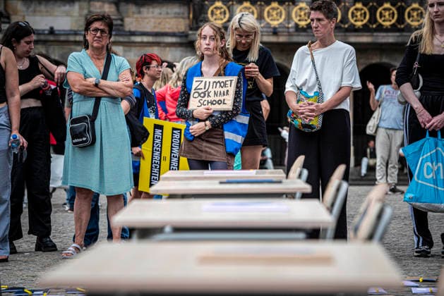 August 15, 2026, Amsterdam, North Holland, The Netherlands Holland: A demonstrator holds a sign reading Ã¢â‚¬oeShe also has to go to schoolÃ¢â‚¬Â (translated from Dutch). August 15, 2026, Amsterdam, The Netherlands. Demonstrators gathered on Dam Square, Amsterdam, in solidarity with Afghan women and girls. The protest marked five years of Taliban rule and demanded access to education for women and girls be restored, and an end to Brussels engagement with the Taliban regime. Amsterdam The Netherlands Holland - ZUMAp202 20260815_zip_p202_016 Copyright: xJamesxPetermeierx