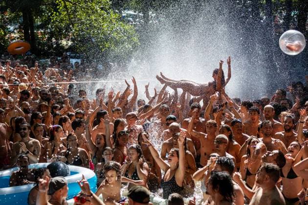 August 15, 2026, Paredes De Coura, Braga, Portugal: A festivalgoer is lifted above the crowd in the water as people celebrate MEUTEÃ¢â‚¬â ¢s surprise afternoon performance at the river Coura - known locally as Ã¢â‚¬oeCouraoÂ­soÃ¢â‚¬Â - during the final day of Vodafone Paredes de Coura. Paredes De Coura Portugal  - ZUMAs197 20260815_aaa_s197_117 Copyright: xDiogoxBaptistax