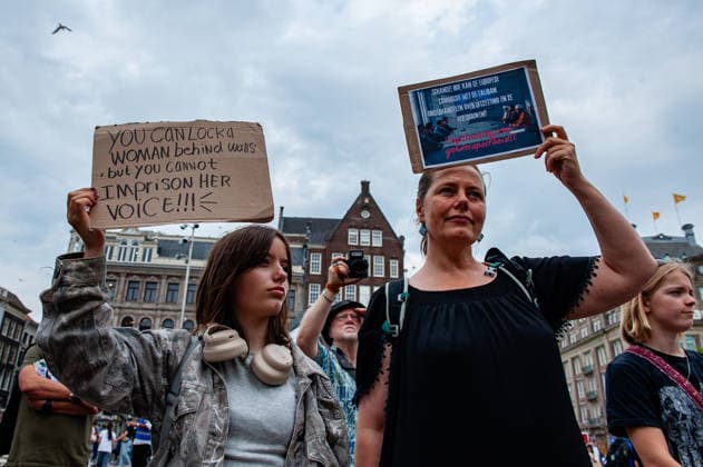 August 15, 2026, Amsterdam, Netherlands: Protesters hold placards during the rally. On the fifth anniversary of the Taliban™s capture of Kabul, in Afghanistan, several organizations held a demonstration to demand that the Netherlands and the EU stop legitimizing the Taliban and prioritize the rights of Afghan women. Under the Taliban, girls are barred from education beyond primary school, and women are banned from many jobs. There are laws dictating that women must cover their faces in public and forbidding them from entering public parks. Human rights groups call it gender apartheid. Amsterdam Netherlands - ZUMAs197 20260815_aaa_s197_137 Copyright: xAnaxFernandezx