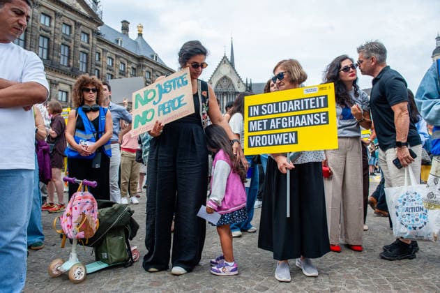 August 15, 2026, Amsterdam, Netherlands: Protesters hold placards during the rally. On the fifth anniversary of the Taliban™s capture of Kabul, in Afghanistan, several organizations held a demonstration to demand that the Netherlands and the EU stop legitimizing the Taliban and prioritize the rights of Afghan women. Under the Taliban, girls are barred from education beyond primary school, and women are banned from many jobs. There are laws dictating that women must cover their faces in public and forbidding them from entering public parks. Human rights groups call it gender apartheid. Amsterdam Netherlands  - ZUMAs197 20260815_aaa_s197_139 Copyright: xAnaxFernandezx