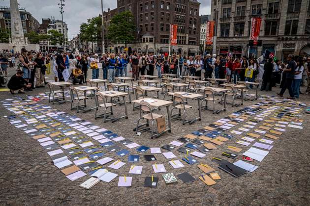 August 15, 2026, Amsterdam, Netherlands: Notebooks and pens are set out as a call for education freedom in Afghanistan. Demonstrators gathered on Dam Square, Amsterdam, in solidarity with Afghan women and girls. The protest marked five years of Taliban rule and demanded access to education for women and girls be restored, and an end to Brussels engagement with the Taliban regime. Amsterdam Netherlands - ZUMAp202 20260815_zip_p202_026 Copyright: xJamesxPetermeierx
