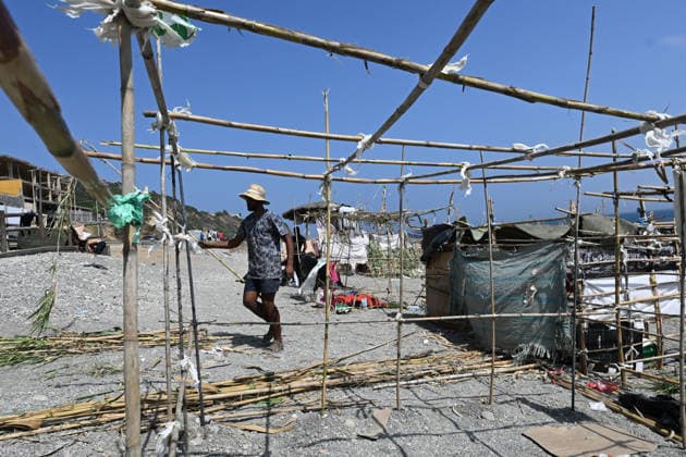 (260815) -- CEUTA, Aug. 15, 2026 -- Irregular migrants build makeshift shelters in Ceuta, Spain, Aug. 15, 2026. More than 72,000 migrants crossed irregularly into Ceuta from neighboring Morocco on July 30 and 31, according to the Spanish government. Most returned to Morocco later, while thousands remain in the enclave.Security was also tightened along the border ahead of Saturday after calls for another mass crossing circulated on social media. Moroccan security forces intercepted hundreds of migrants attempting to reach the border area, while Ceuta reported no influx on a scale comparable to that seen in late July. ) SPAIN-CEUTA-VIEW ChengxMin 
