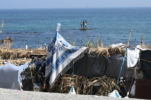 (260815) -- CEUTA, Aug. 15, 2026 -- Irregular migrants are seen in Ceuta, Spain, Aug. 15, 2026. More than 72,000 migrants crossed irregularly into Ceuta from neighboring Morocco on July 30 and 31, according to the Spanish government. Most returned to Morocco later, while thousands remain in the enclave.Security was also tightened along the border ahead of Saturday after calls for another mass crossing circulated on social media. Moroccan security forces intercepted hundreds of migrants attempting to reach the border area, while Ceuta reported no influx on a scale comparable to that seen in late July. ) SPAIN-CEUTA-VIEW ChengxMin 